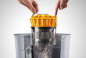 The Dyson Dyson Ball Multi Floor canister vacuum cleaner. Hygienic bin emptying. Just push the button to release the dirt.