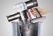 The Dyson V6 cordless vacuum cleaner. Hygienic bin emptying. Just push the button to release the dirt.