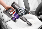 The Dyson V6 Trigger Handheld vacuum cleaner. In car cleaning.  