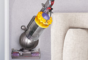 The Dyson Ball Multi Floor upright vacuum cleaner. Ball™ technology. Rides on a ball - steers easily into difficult places.