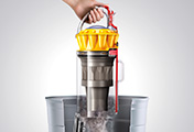 The Dyson Ball Multi Floor upright vacuum cleaner. Hygienic bin emptying. Just push the button to release the dirt. 